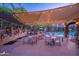 Inviting poolside patio with shade, dining tables, multiple grills, and lounge seating for outdoor enjoyment at 5450 E Deer Valley Dr # 1195, Phoenix, AZ 85054