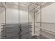 Walk-in closet with metal shelving, drawers, and ample storage space, designed for organization and convenience at 5450 E Deer Valley Dr # 1195, Phoenix, AZ 85054