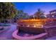 Stunning fire and water feature at dusk, complete with stone accents and lush landscaping at 5450 E Deer Valley Dr # 1195, Phoenix, AZ 85054