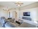 Expansive living room showcasing a large couch, modern entertainment setup, and open access to the kitchen at 5944 W Greenbriar Dr, Glendale, AZ 85308