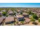 Overhead aerial shot of a neighborhood featuring a two-story home with desert landscaping at 5973 S Legend Dr, Gilbert, AZ 85298