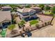 Expansive backyard featuring a well-maintained lawn, decorative rocks, privacy fence, and desert landscaping at 5973 S Legend Dr, Gilbert, AZ 85298