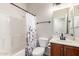 Clean bathroom with white tile shower, updated fixtures, and wood vanity at 5973 S Legend Dr, Gilbert, AZ 85298