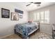 Comfortable bedroom with carpet, ceiling fan and Harry Potter themed decor at 5973 S Legend Dr, Gilbert, AZ 85298