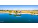 Aerial view of the lake in the community, highlighting a pavilion with views of the surrounding park at 5973 S Legend Dr, Gilbert, AZ 85298