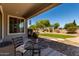 Relaxing outdoor space with decorative rugs, elegant patio seating, and a serene view of the backyard at 5973 S Legend Dr, Gilbert, AZ 85298