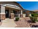 Cozy front porch features stone accents, decorative shrubs, and a clear view to the doorway at 5973 S Legend Dr, Gilbert, AZ 85298