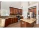 Open kitchen with stainless steel appliances, granite countertops, wood floors, and recessed lighting at 5973 S Legend Dr, Gilbert, AZ 85298