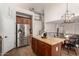 Spacious kitchen featuring stainless steel appliances, a center island, and ample storage for all your cooking needs at 5973 S Legend Dr, Gilbert, AZ 85298