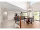 Inviting living room with a cozy dining area and stylish light fixture creates a welcoming space at 5973 S Legend Dr, Gilbert, AZ 85298