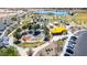 Aerial view of community splash pad and playground with recreational activities, landscaping, parking and lake at 5973 S Legend Dr, Gilbert, AZ 85298