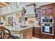 Gourmet kitchen with custom cabinets, stainless steel appliances, and a breakfast bar with counter seating at 6124 N 31St Ct, Phoenix, AZ 85016