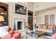Elegant living room with a fireplace, custom built-ins, and sophisticated furniture at 6124 N 31St Ct, Phoenix, AZ 85016