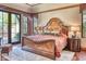 Bedroom features a decorative ceiling, wood floors, and access to the patio through French doors at 6124 N 31St Ct, Phoenix, AZ 85016