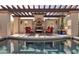 Beautiful pool with pergola, fireplace and seating; desert landscaping at 6124 N 31St Ct, Phoenix, AZ 85016