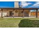 Covered outdoor patio with view of backyard and perimeter fence at 6203 W Caribe Ln, Glendale, AZ 85306