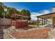 Backyard with a pergola, concrete pad, covered patio and perimeter fence at 6203 W Caribe Ln, Glendale, AZ 85306