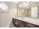 Bright bathroom with tile floors, undermount sink, and a large mirror at 6203 W Caribe Ln, Glendale, AZ 85306
