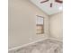 This bedroom features tile flooring, neutral walls, and a window with blinds at 6203 W Caribe Ln, Glendale, AZ 85306