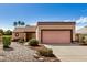Charming single-story home featuring a two-car garage and a well-maintained front yard with desert landscaping at 6203 W Caribe Ln, Glendale, AZ 85306
