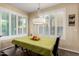 Bright dining room featuring many windows with shutters and a decorative chandelier at 6449 S Glory Ct, Gilbert, AZ 85298