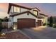 Lovely two-story home with a three-car garage and a spacious driveway for ample parking at 6449 S Glory Ct, Gilbert, AZ 85298