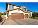 Lovely two-story home with a three-car garage and a spacious driveway for ample parking at 6449 S Glory Ct, Gilbert, AZ 85298