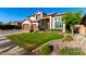 Beautiful two-story home features well-manicured landscaping, enhancing curb appeal at 6449 S Glory Ct, Gilbert, AZ 85298