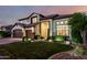 Beautiful two-story home features well-manicured landscaping, enhancing curb appeal at 6449 S Glory Ct, Gilbert, AZ 85298