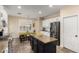 Well-equipped kitchen with stainless steel appliances, granite countertops, and convenient center island at 6449 S Glory Ct, Gilbert, AZ 85298