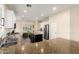 Spacious kitchen featuring white cabinets, an island with barstool seating, and stainless steel appliances at 6449 S Glory Ct, Gilbert, AZ 85298
