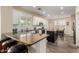 Beautiful kitchen with white cabinets, stainless steel appliances, and a center island with barstool seating at 6449 S Glory Ct, Gilbert, AZ 85298