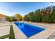 Beautiful pool and patio area, complete with luxurious lounge chairs and umbrellas for relaxing at 6449 S Glory Ct, Gilbert, AZ 85298