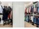 Organized walk-in closet with ample hanging space and storage for clothes and accessories at 6449 S Glory Ct, Gilbert, AZ 85298