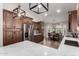 Bright kitchen showcasing custom wood cabinetry, stainless appliances, and quartz countertops with eat in kitchen area at 7185 W Kimberly Way, Glendale, AZ 85308