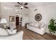 Elegant living room featuring hardwood floors, neutral-toned furniture, and a vaulted ceiling at 7185 W Kimberly Way, Glendale, AZ 85308
