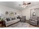 Inviting living room with hardwood floors, a plush sofa, and tasteful decor at 7185 W Kimberly Way, Glendale, AZ 85308
