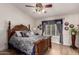 Comfortable main bedroom featuring beautiful wood furniture, a vaulted ceiling, and a ceiling fan at 7185 W Kimberly Way, Glendale, AZ 85308