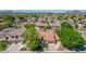 Aerial view of a home with mature trees and well-maintained landscaping at 7236 W Aurora Dr, Glendale, AZ 85308