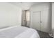 Bright bedroom with sliding closet doors and a gray patterned bedspread is filled with natural light at 7236 W Aurora Dr, Glendale, AZ 85308