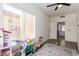 Bonus Room or Playroom featuring a window and an opening to another room at 7236 W Aurora Dr, Glendale, AZ 85308