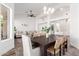 Spacious dining area showcasing stylish lighting and seamlessly connected to living space at 7236 W Aurora Dr, Glendale, AZ 85308