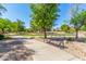Community park pathway with benches and landscaping, inviting residents to relax and enjoy outdoor space at 7236 W Aurora Dr, Glendale, AZ 85308