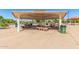 Shaded picnic area in the park, featuring tables and benches for outdoor dining and community gatherings at 7236 W Aurora Dr, Glendale, AZ 85308