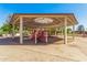 Shaded playground featuring play structures and equipment for children, providing a safe and fun recreational space at 7236 W Aurora Dr, Glendale, AZ 85308
