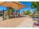 Neighborhood playground featuring modern equipment, including slides and climbing structures, shaded by a canopy at 7236 W Aurora Dr, Glendale, AZ 85308