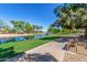 Peaceful community pond surrounded by lush greenery and walking paths, offering a tranquil space at 7236 W Aurora Dr, Glendale, AZ 85308
