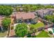 Stunning backyard with a sparkling pool, lush lawn, covered patio, and inviting fire pit area at 7236 W Aurora Dr, Glendale, AZ 85308