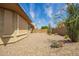 Backyard featuring a low-maintenance desert landscape with gravel and cacti at 7251 E Portobello Ave, Mesa, AZ 85212