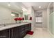 Spacious en-suite bathroom with dual sinks, granite countertop, and walk-in shower at 7251 E Portobello Ave, Mesa, AZ 85212